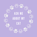 A round, 2-inch fridge magnet featuring a purple background with white paw prints circling text that reads, 'Ask me about my cat'