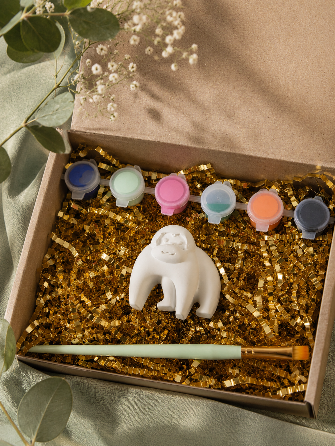 Paintable ceramic gorilla figurine kit with paintbrush and assorted paint colors