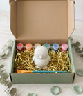 Paintable ceramic penguin figurine kit with paintbrush and assorted paint colors