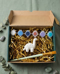 Paintable ceramic dinosaur figurine kit with paintbrush and assorted paint colors