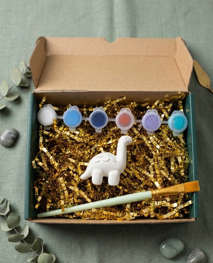 Paintable ceramic dinosaur figurine kit with paintbrush and assorted paint colors