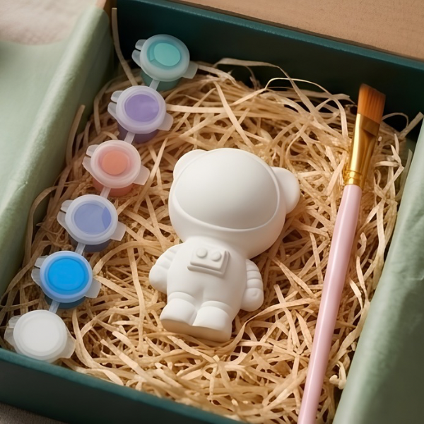 Paintable ceramic space bear figurine kit with paintbrush and assorted paint colors