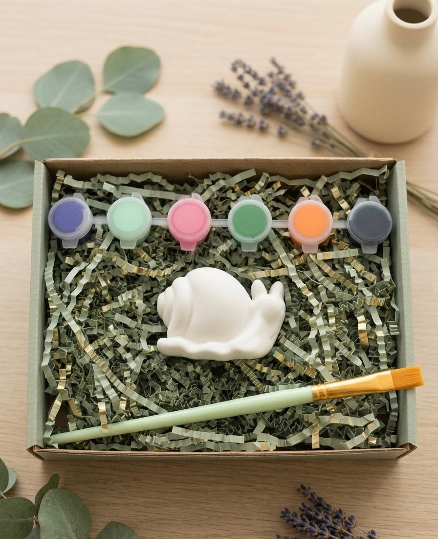 Paintable ceramic snail figurine kit with paintbrush and assorted paint colors
