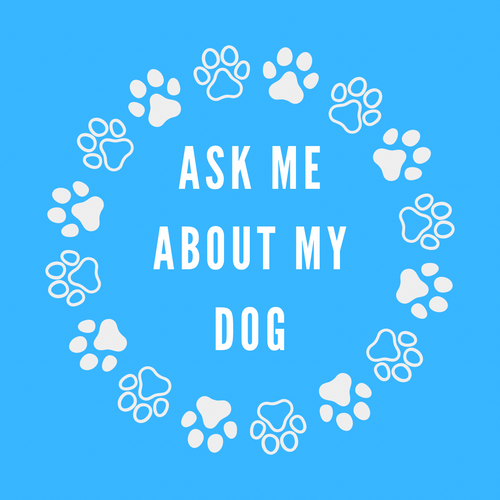 A round, 2-inch fridge magnet featuring a purple background with white paw prints circling text that reads, 'Ask me about my dog'