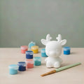 Paintable ceramic reindeer figurine kit with paintbrush and assorted paint colors