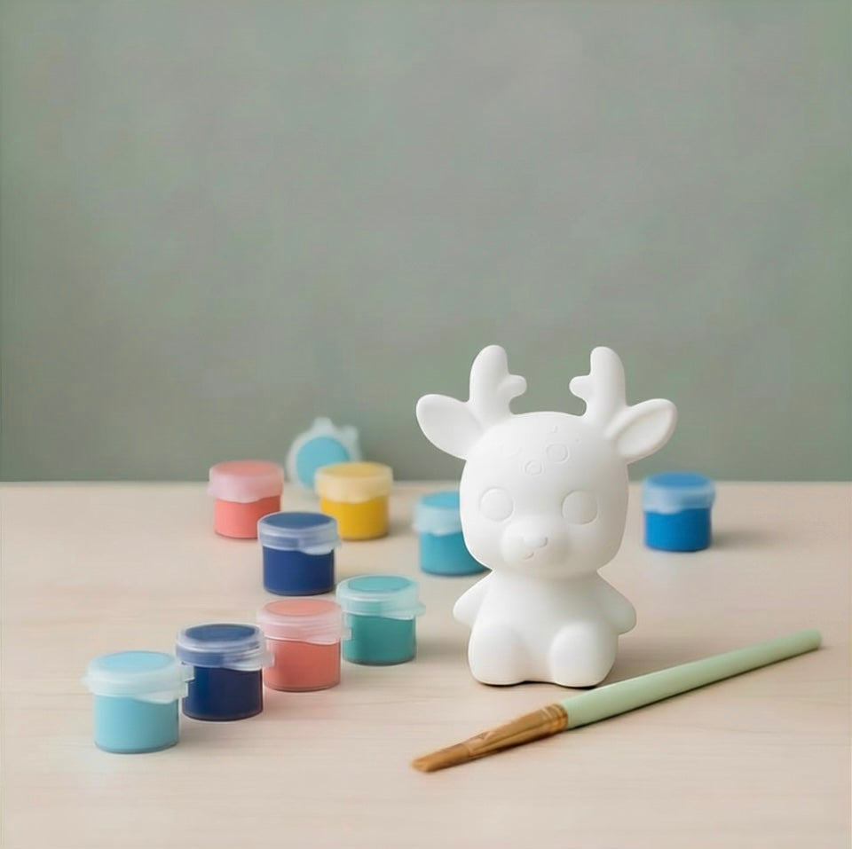 Paintable ceramic reindeer figurine kit with paintbrush and assorted paint colors