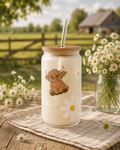 Frosted can cup with a highland cow and daisies.