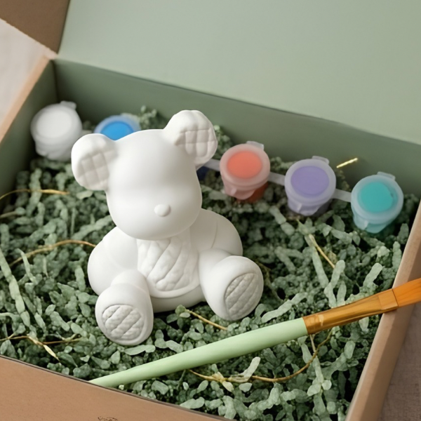 Paintable ceramic bear figurine kit with paintbrush and assorted paint colors