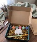 Paintable ceramic elephant figurine kit with paintbrush and assorted paint colors