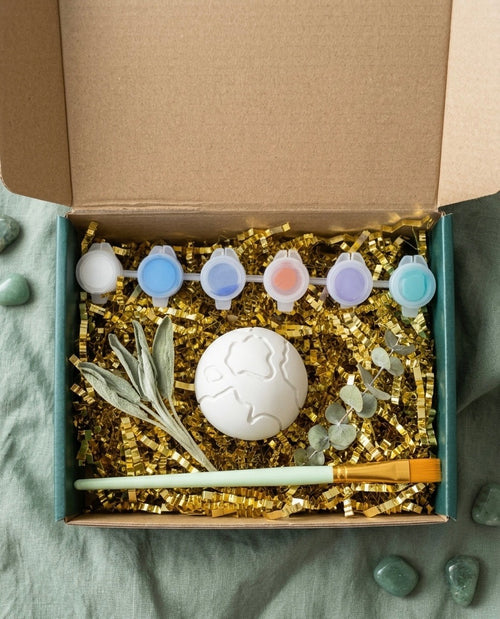 Paintable ceramic earth figurine kit with paintbrush and assorted paint colors
