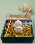 Paintable ceramic duckling figurine kit with paintbrush and assorted paint colors