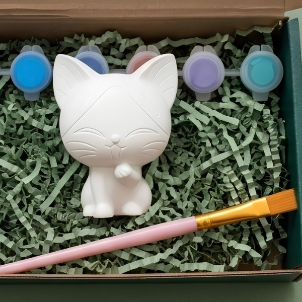 Paintable ceramic cat figurine kit with paintbrush and assorted paint colors