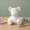 Paintable ceramic bear figurine kit with paintbrush and assorted paint colors
