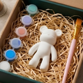 Paintable ceramic bear figurine kit with paintbrush and assorted paint colors