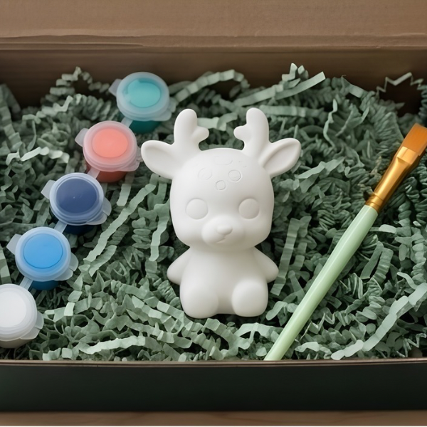 Paintable ceramic reindeer figurine kit with paintbrush and assorted paint colors