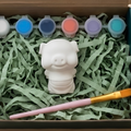Paintable ceramic pig figurine kit with paintbrush and assorted paint colors