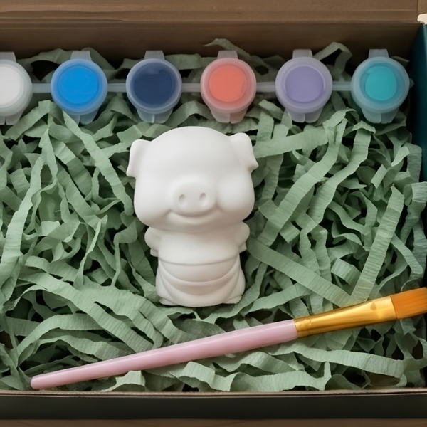 Paintable ceramic pig figurine kit with paintbrush and assorted paint colors