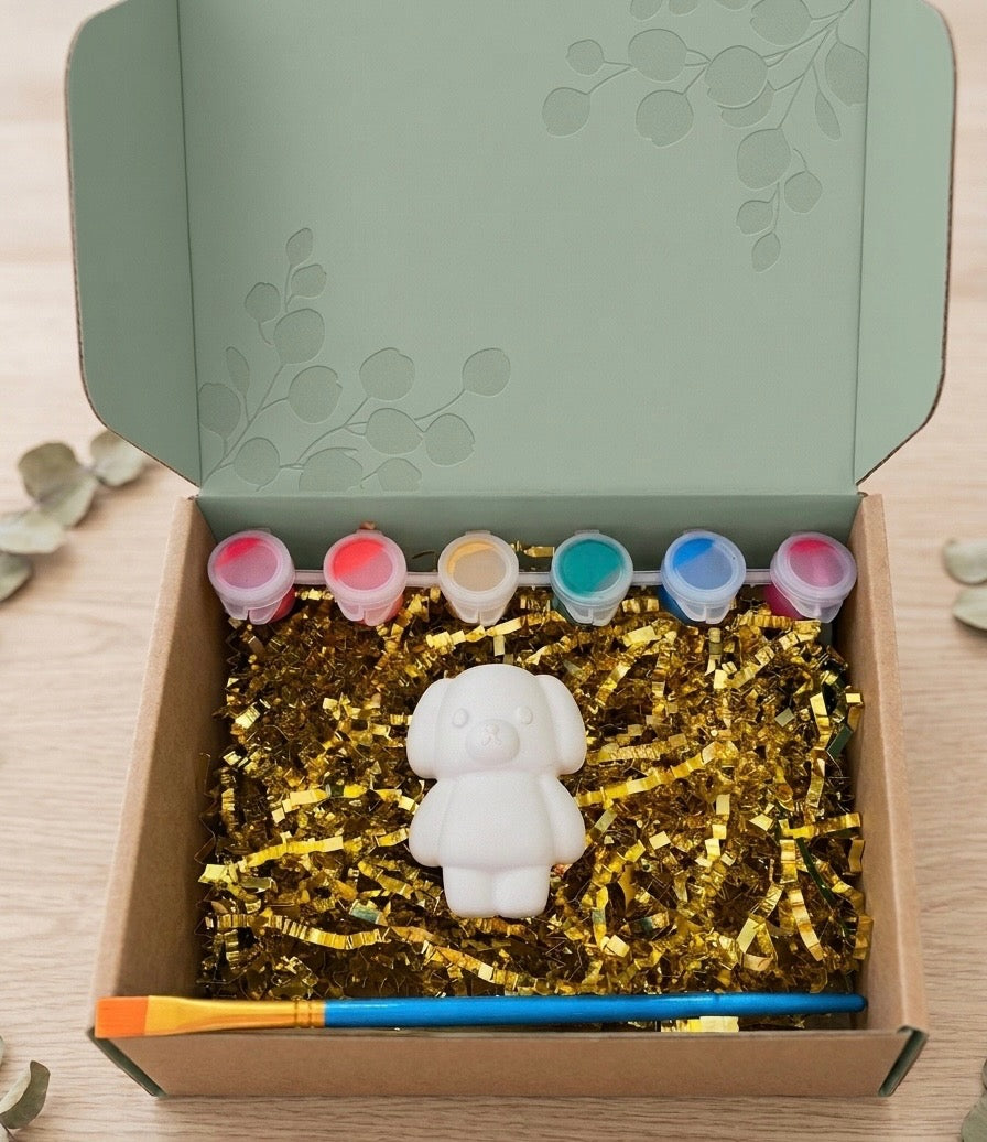 Paintable ceramic dog figurine kit with paintbrush and assorted paint colors