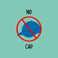 A round, 2-inch fridge magnet with a prohibited sign over an illustrated blue cap on a light green background with black text that reads, 'NO CAP'