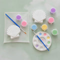 Paintable ceramic seashell figurine kit with paintbrush and assorted paint colors
