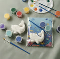 Paintable ceramic dolphin figurine kit with paintbrush and assorted paint colors