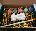 Paintable ceramic race car figurine kit with paintbrush and assorted paint colors