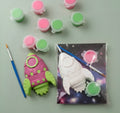 Paintable ceramic rocket figurine kit with paintbrush and assorted paint colors