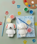 Paintable ceramic dog figurine kit with paintbrush and assorted paint colors