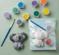 Paintable ceramic koala figurine kit with paintbrush and assorted paint colors