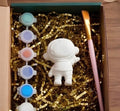 Paintable ceramic astronaut figurine kit with paintbrush and assorted paint colors