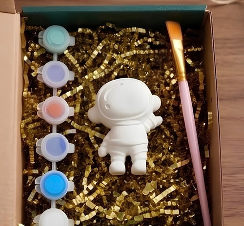 Paintable ceramic astronaut figurine kit with paintbrush and assorted paint colors