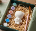 Paintable ceramic space bear figurine kit with paintbrush and assorted paint colors