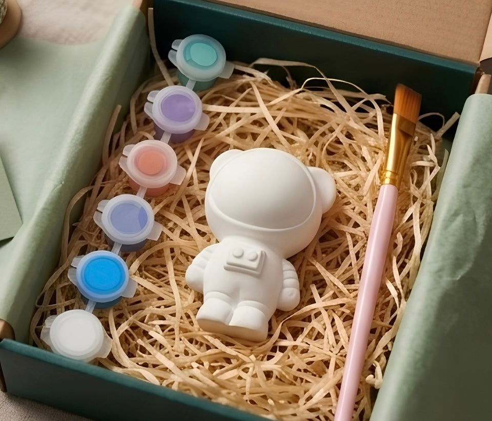 Paintable ceramic space bear figurine kit with paintbrush and assorted paint colors
