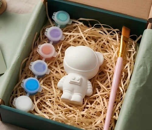 Paintable ceramic space bear figurine kit with paintbrush and assorted paint colors