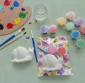 Paintable ceramic snail figurine kit with paintbrush and assorted paint colors