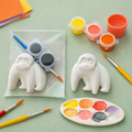 Paintable ceramic gorilla figurine kit with paintbrush and assorted paint colors