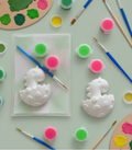 Paintable ceramic dinosaur egg figurine kit with paintbrush and assorted paint colors