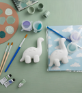 Paintable ceramic brachiosaurus figurine kit with paintbrush and assorted paint colors