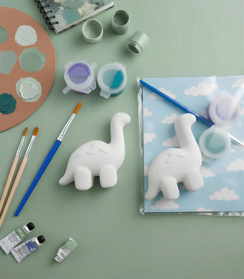 Paintable ceramic brachiosaurus figurine kit with paintbrush and assorted paint colors