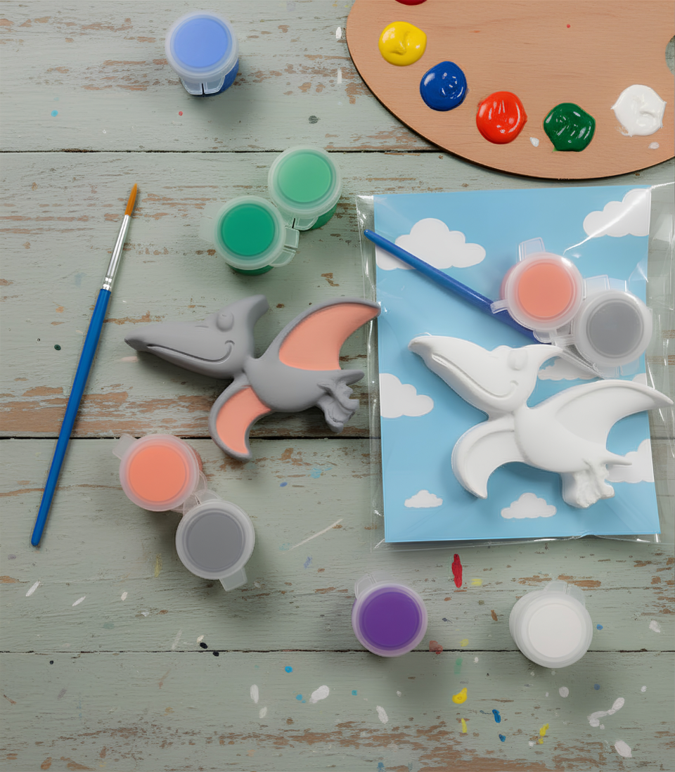 Paintable ceramic pterodactyl figurine kit with paintbrush and assorted paint colors