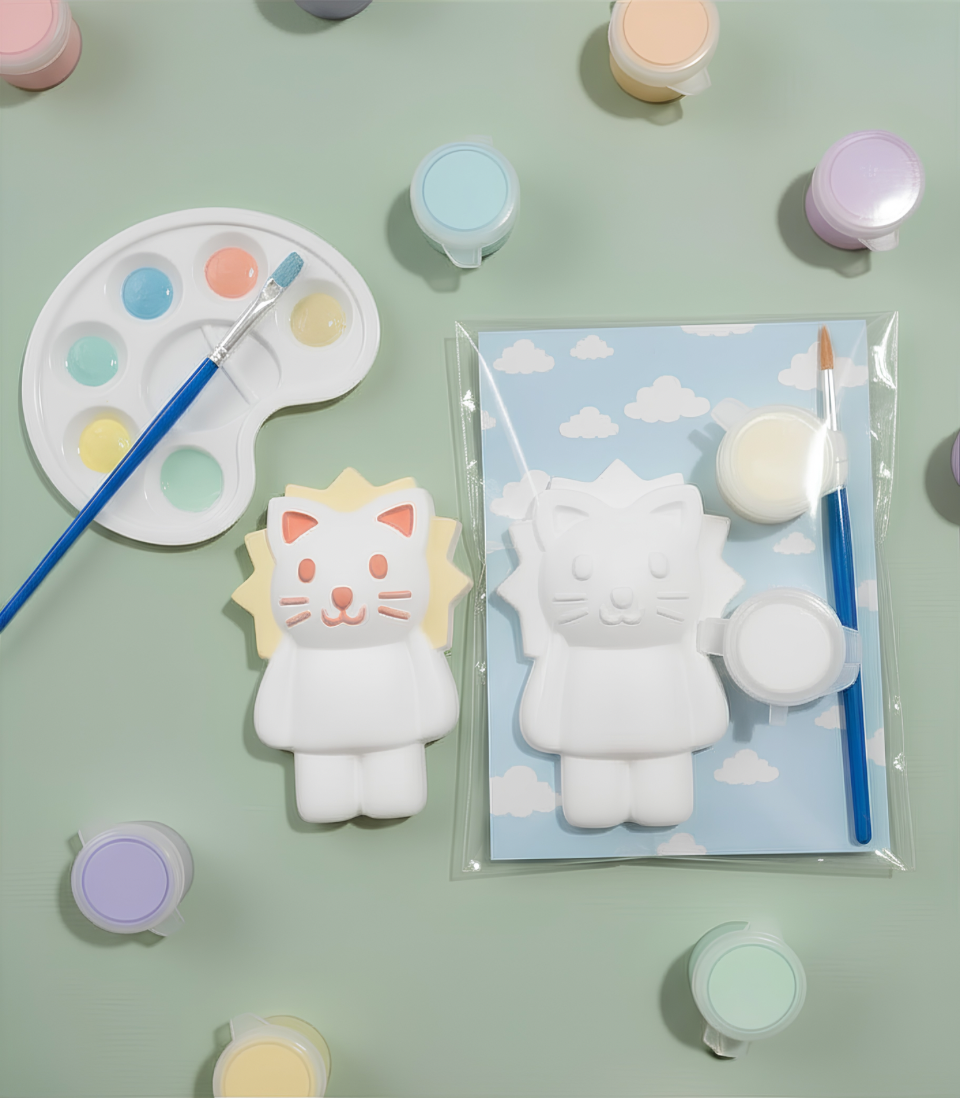 Paintable ceramic lion figurine kit with paintbrush and assorted paint colors