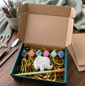 Paintable ceramic elephant figurine kit with paintbrush and assorted paint colors