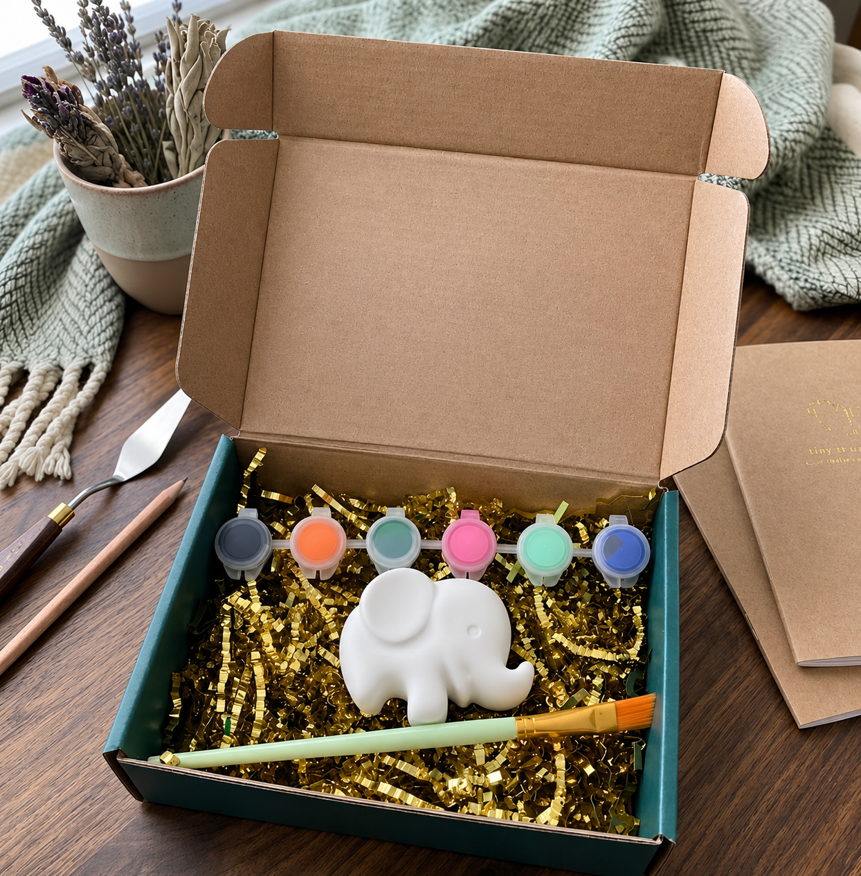 Paintable ceramic elephant figurine kit with paintbrush and assorted paint colors