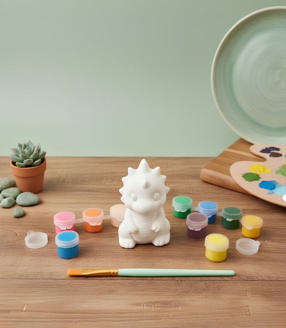 Paintable ceramic dragon figurine kit with paintbrush and assorted paint colors