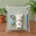 Paintable ceramic bear figurine kit with paintbrush and assorted paint colors